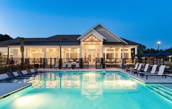 Pool and clubhouse at twilight